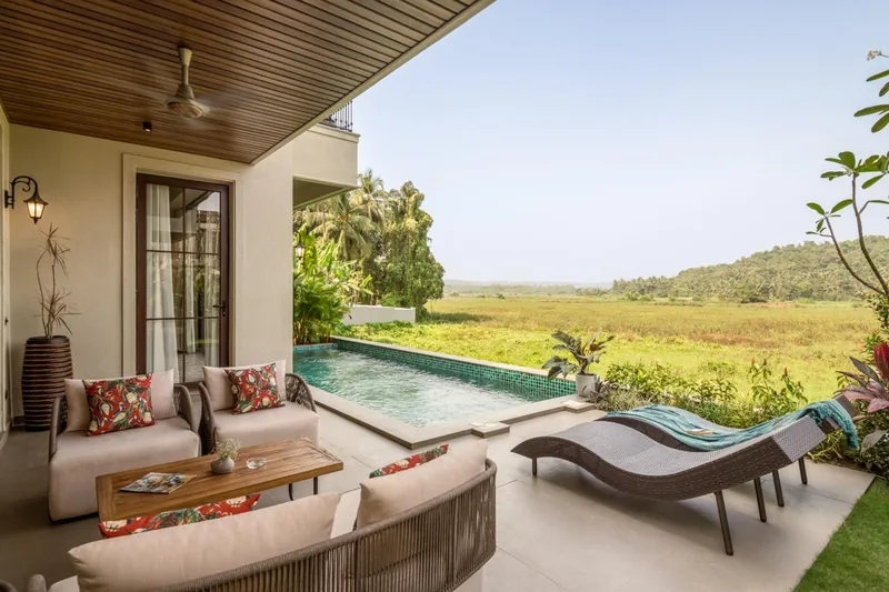 Covered terrace and pool looking across the valley. Banyan Bliss, Guirim.